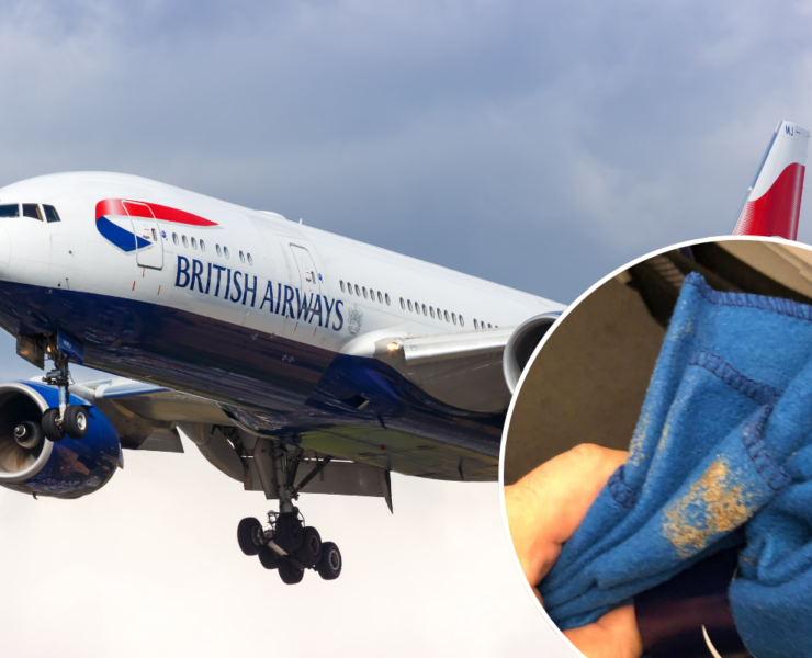 a blue and white airplane with a blue cloth from the ground