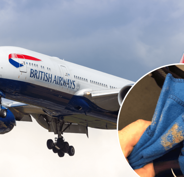 a blue and white airplane with a blue cloth from the ground