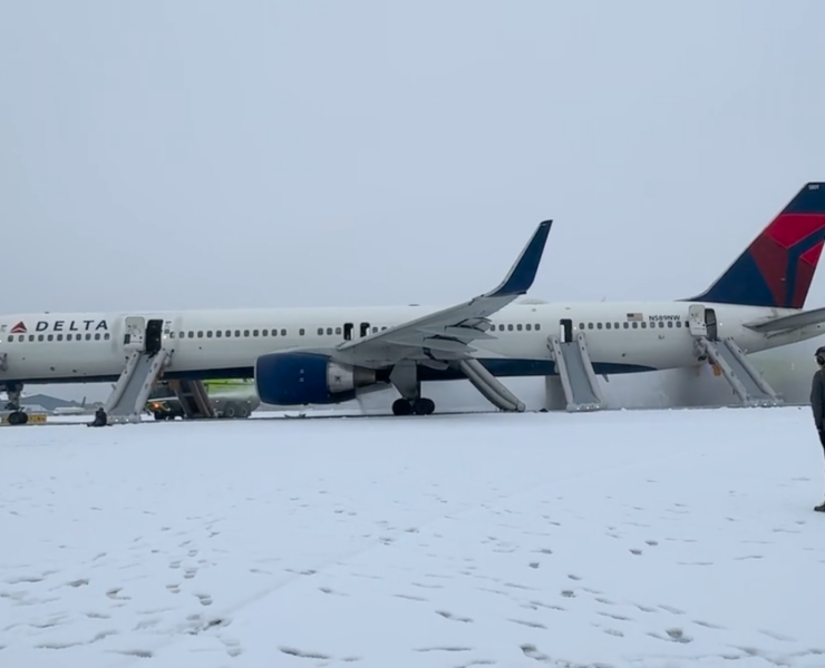 a plane parked on a snowy runway