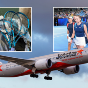 a plane with tennis rackets and people in the background