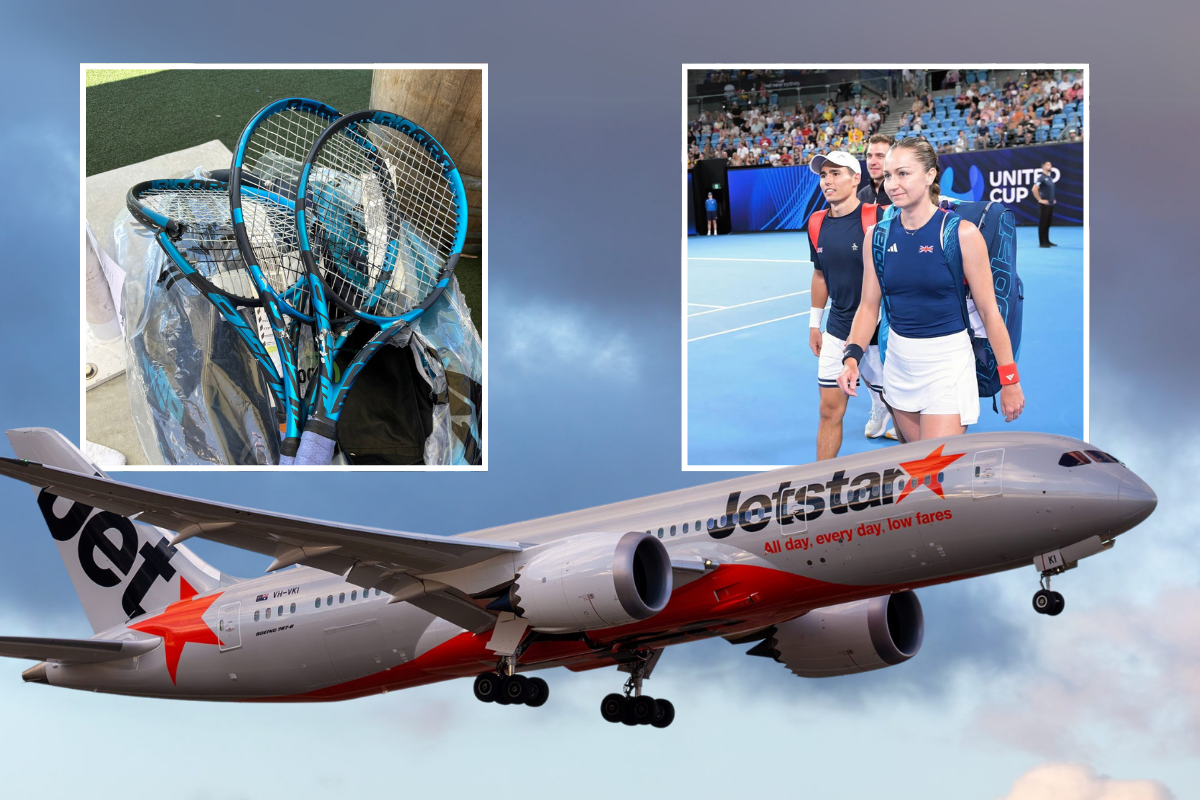 a plane with tennis rackets and people in the background