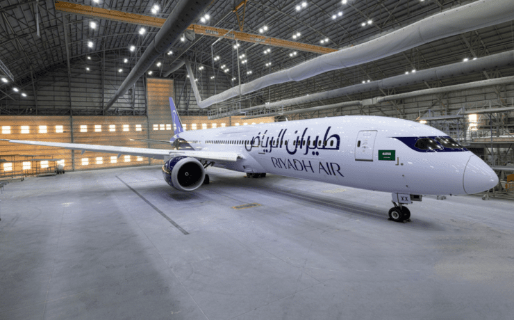 a large white airplane in a hangar