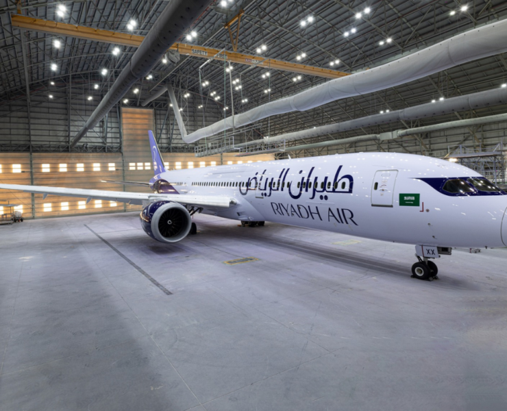 a large white airplane in a hangar