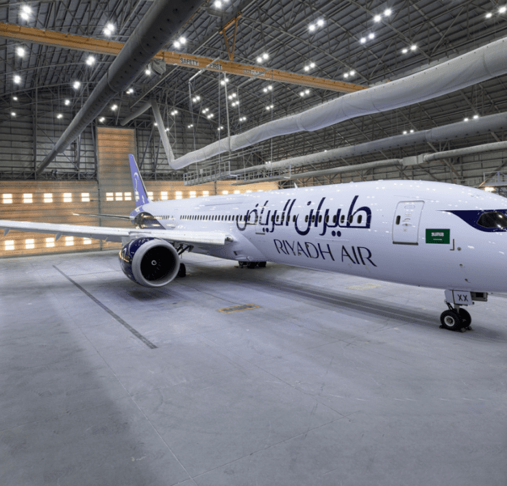 a large white airplane in a hangar