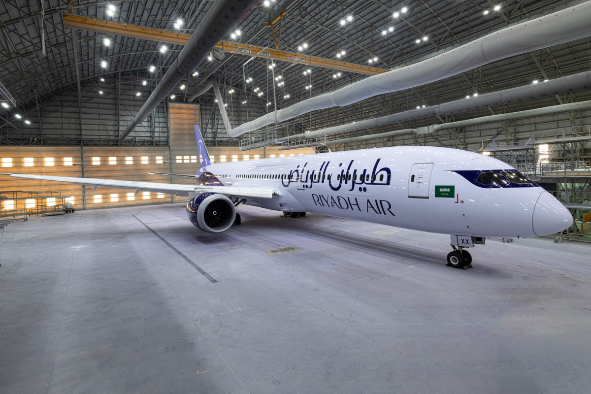 a large white airplane in a hangar